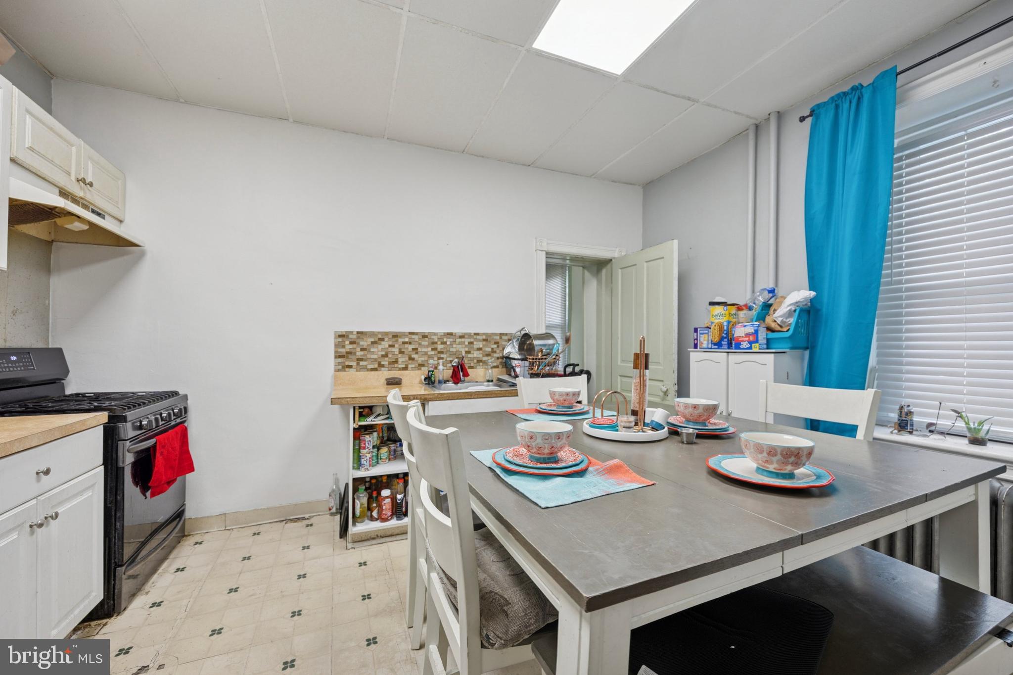 512 Crest Avenue Elkins Park, PA 19027 - Photo 10 of 24 a open dining room with stainless steel appliances a table and chairs