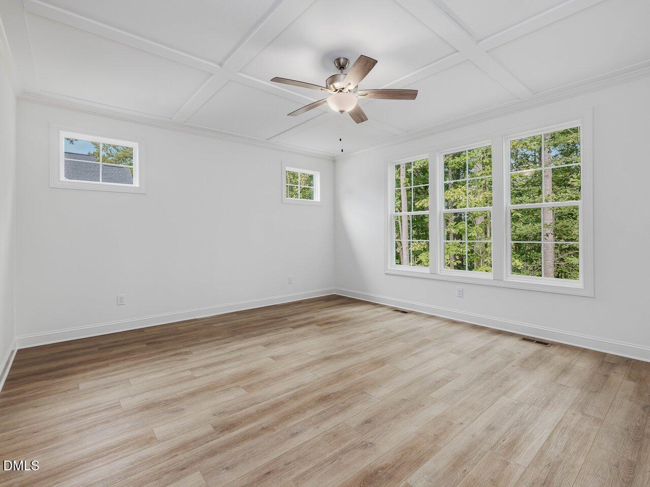 249 High Ridge Lane Pittsboro, NC 27312 - Photo 20 of 65 a view of an empty room with wooden floor and a window