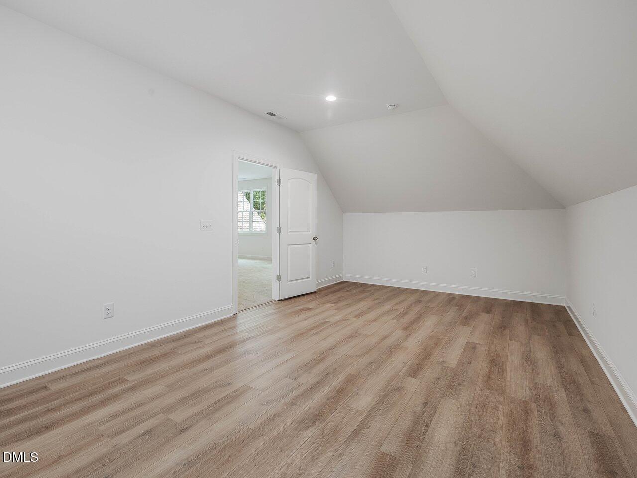 249 High Ridge Lane Pittsboro, NC 27312 - Photo 29 of 65 an empty room with wooden floor and windows