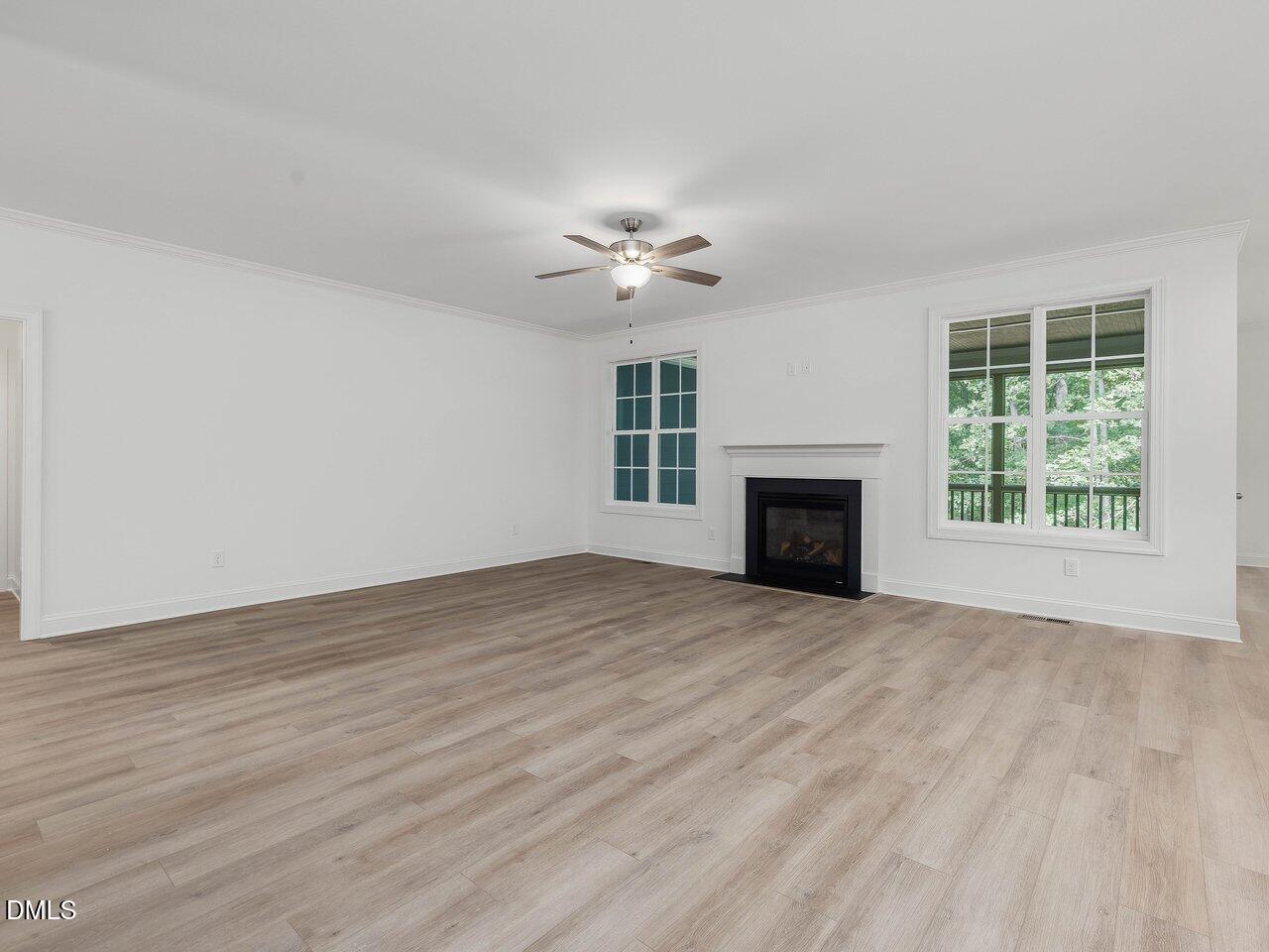 249 High Ridge Lane Pittsboro, NC 27312 - Photo 4 of 65 wooden floor fireplace and natural light in room