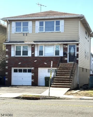 a front view of a house with a garage