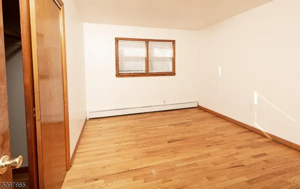 an empty room with a empty space and window