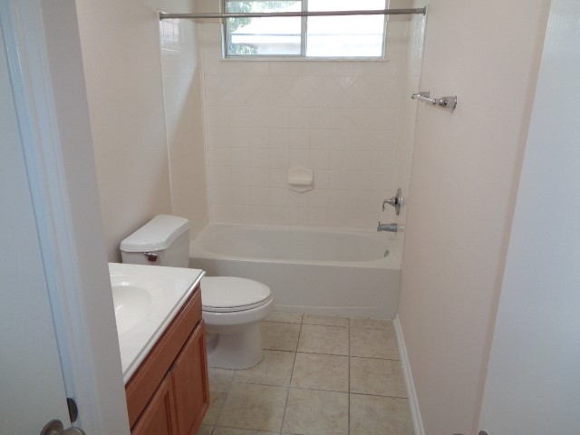 1615 Redbud Grove Court Conroe, TX 77301 - Photo 12 of 20 a bathroom with a sink a toilet and shower