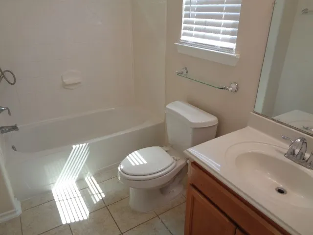 an empty room that has a window in it