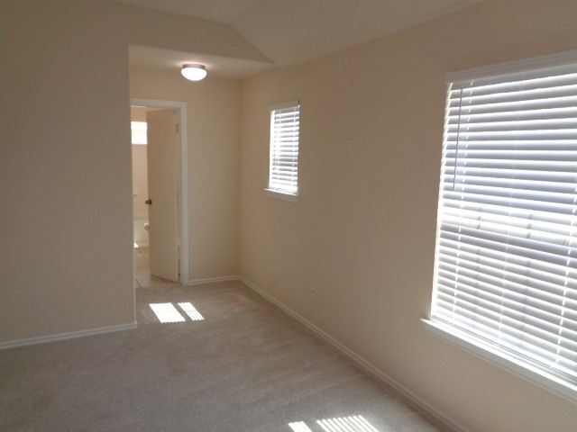 1615 Redbud Grove Court Conroe, TX 77301 - Photo 14 of 20 an empty room that has a window in it