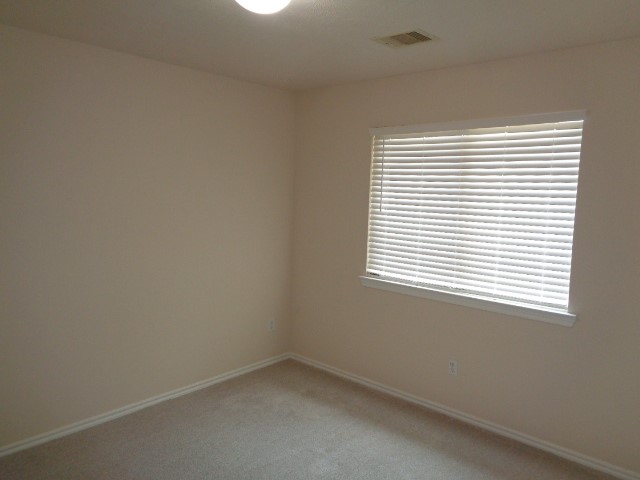 1615 Redbud Grove Court Conroe, TX 77301 - Photo 16 of 20 an empty room with a window
