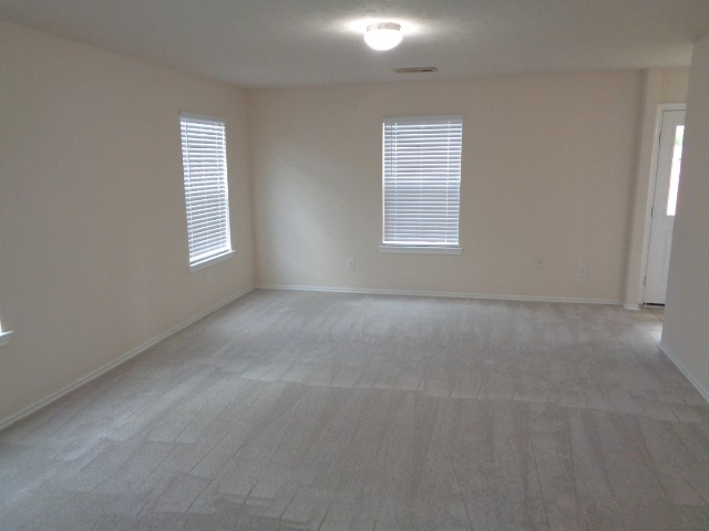 1615 Redbud Grove Court Conroe, TX 77301 - Photo 8 of 20 an empty room with windows