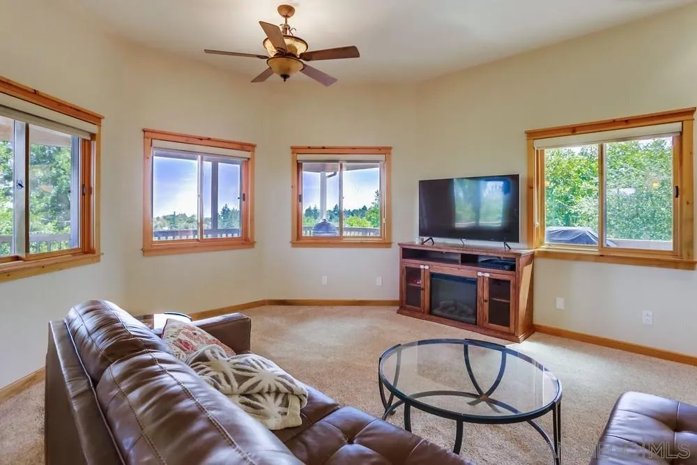 753 Ridgewood Drive Julian, CA 92036 - Photo 4 of 48 a living room with furniture and a flat screen tv