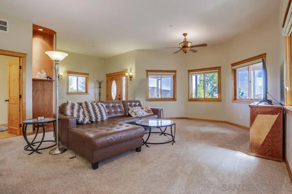 753 Ridgewood Drive Julian, CA 92036 - Photo 6 of 48 a living room with furniture and a chandelier