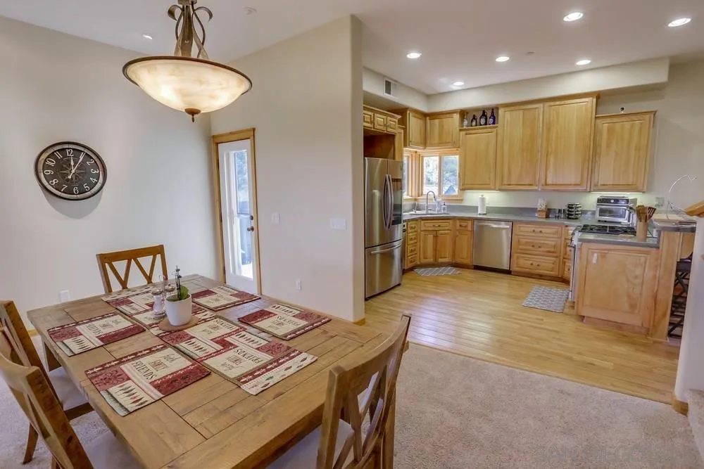 753 Ridgewood Drive Julian, CA 92036 - Photo 7 of 48 a kitchen with a table and chairs in it