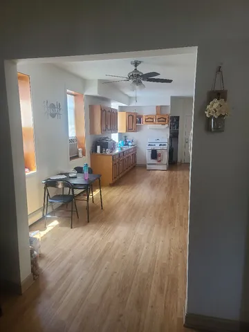 a view of a livingroom with furniture and a window