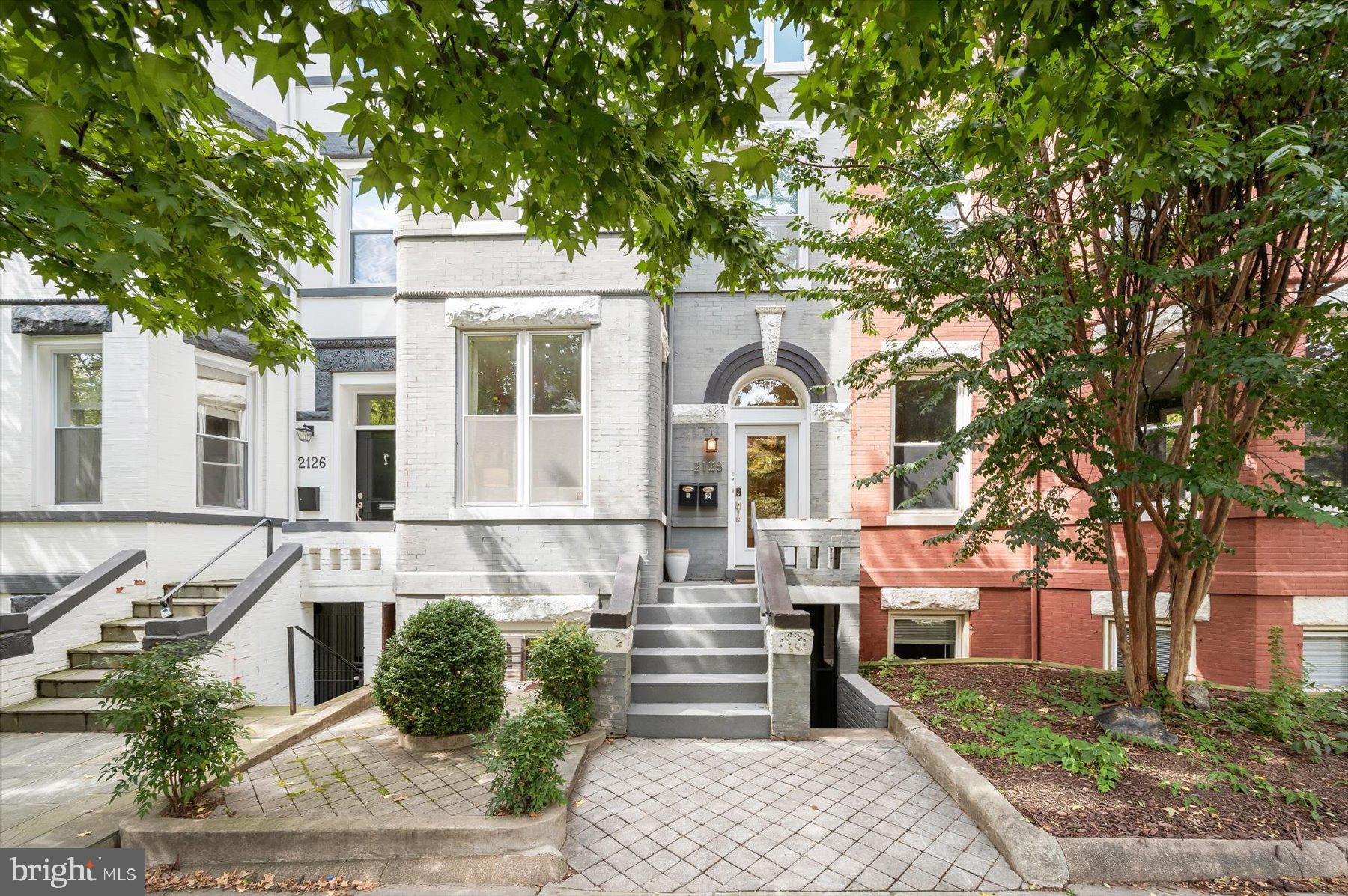2128 1st Street Northwest, Unit 1 Washington, DC 20001 - Photo 1 of 36 a front view of a house with garden