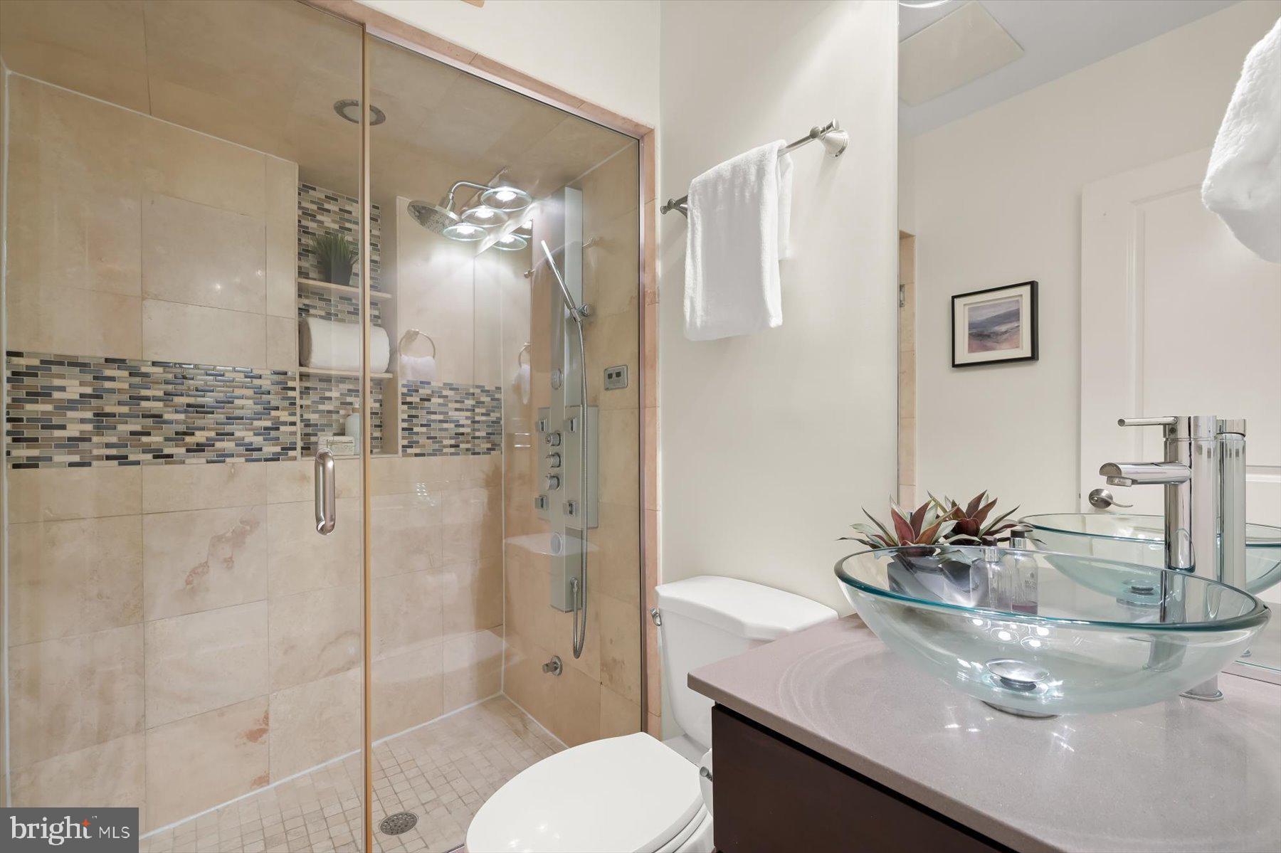2128 1st Street Northwest, Unit 1 Washington, DC 20001 - Photo 15 of 36 a bathroom with a sink toilet and shower