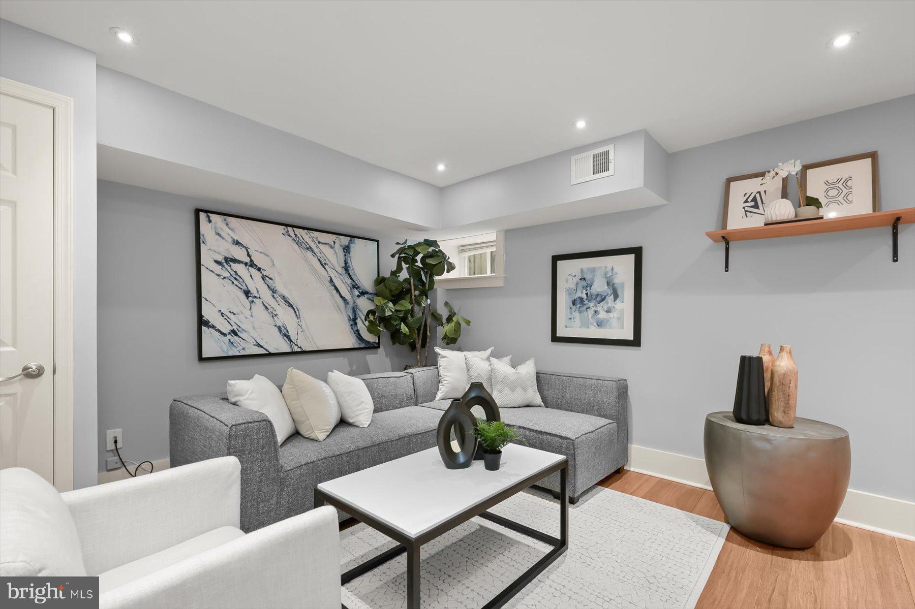2128 1st Street Northwest, Unit 1 Washington, DC 20001 - Photo 20 of 36 a living room with furniture and a potted plant