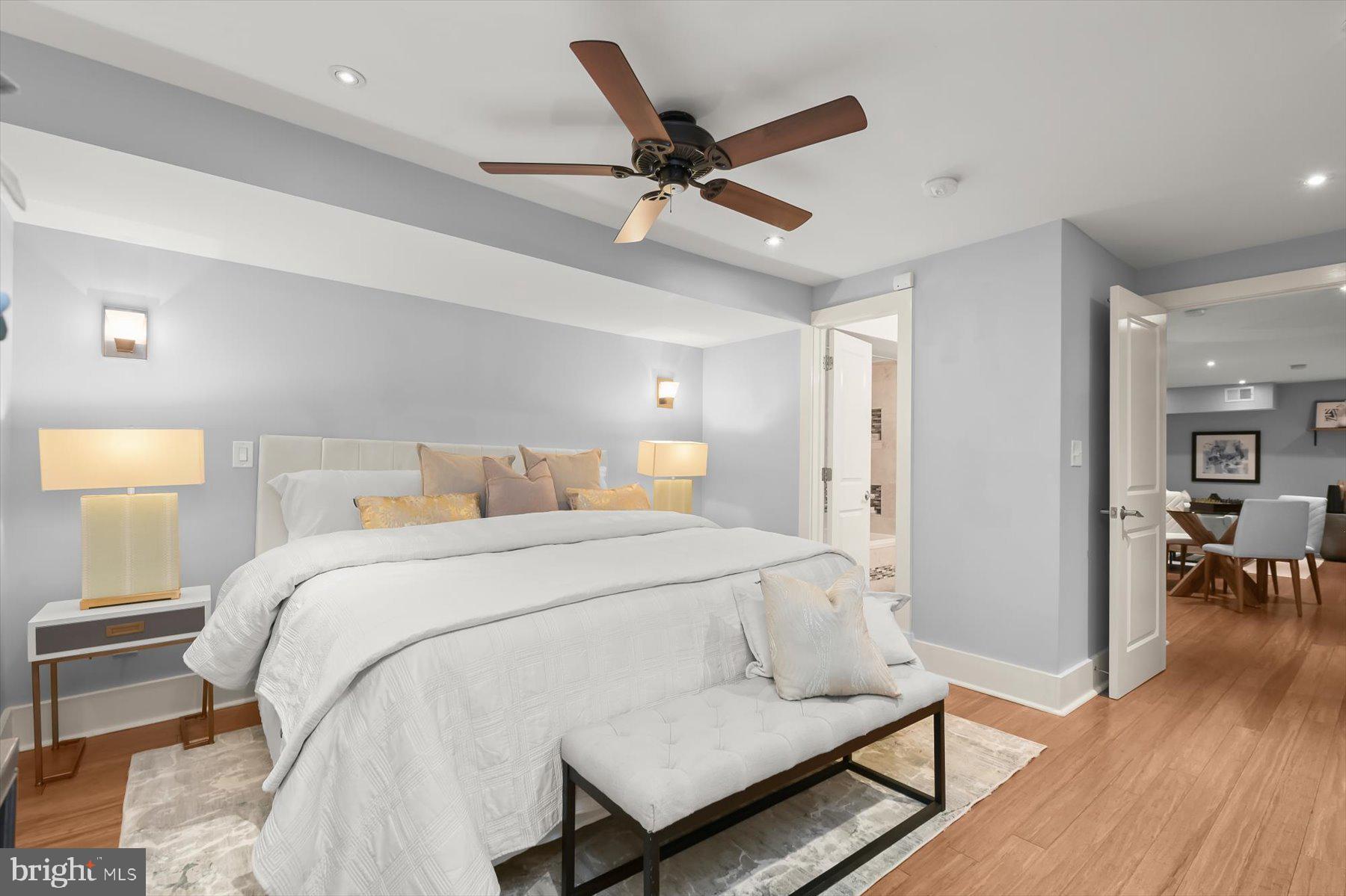 2128 1st Street Northwest, Unit 1 Washington, DC 20001 - Photo 23 of 36 a bed room with bed and a chair