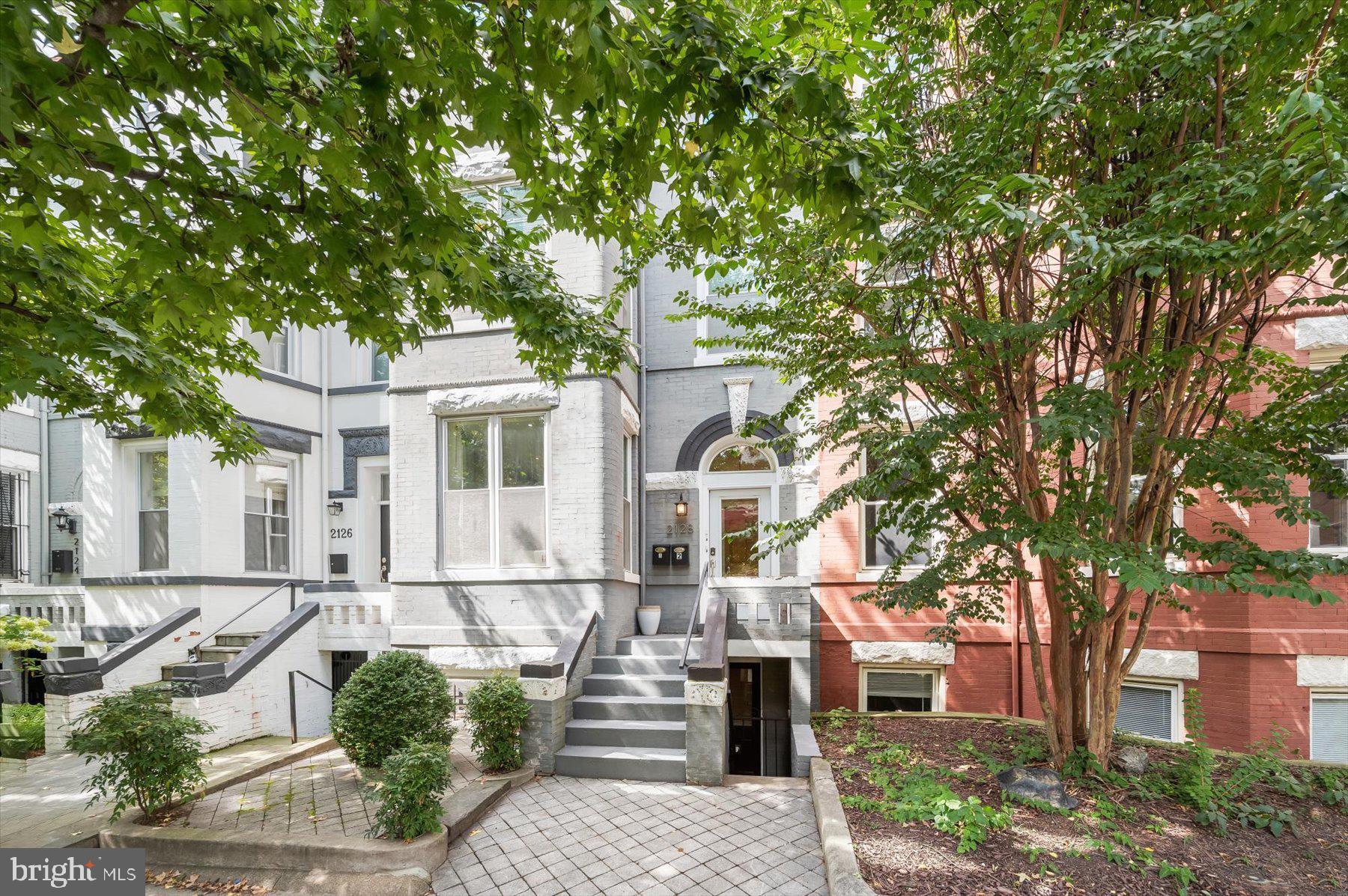 2128 1st Street Northwest, Unit 1 Washington, DC 20001 - Photo 36 of 36 a front view of a house with a tree