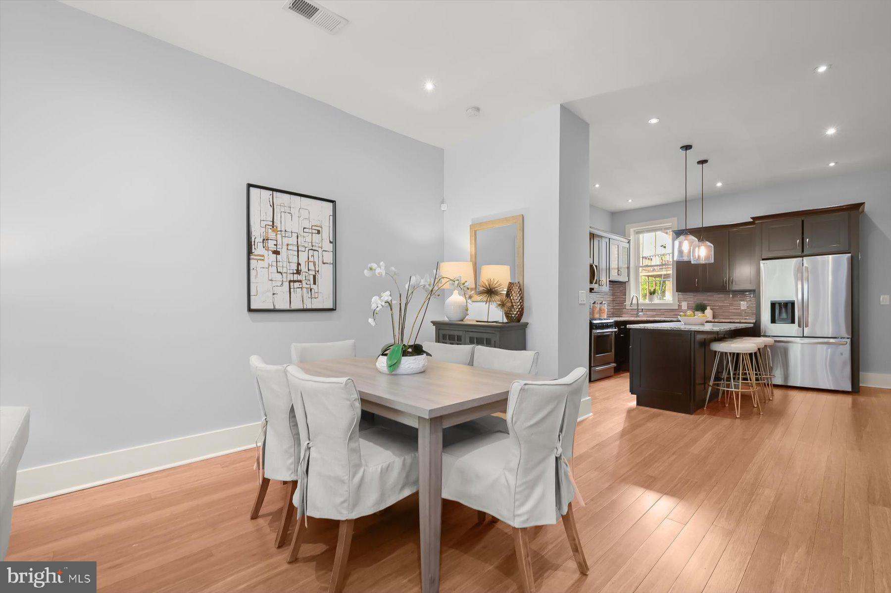 2128 1st Street Northwest, Unit 1 Washington, DC 20001 - Photo 7 of 36 a view of a dining room with furniture and wooden floor