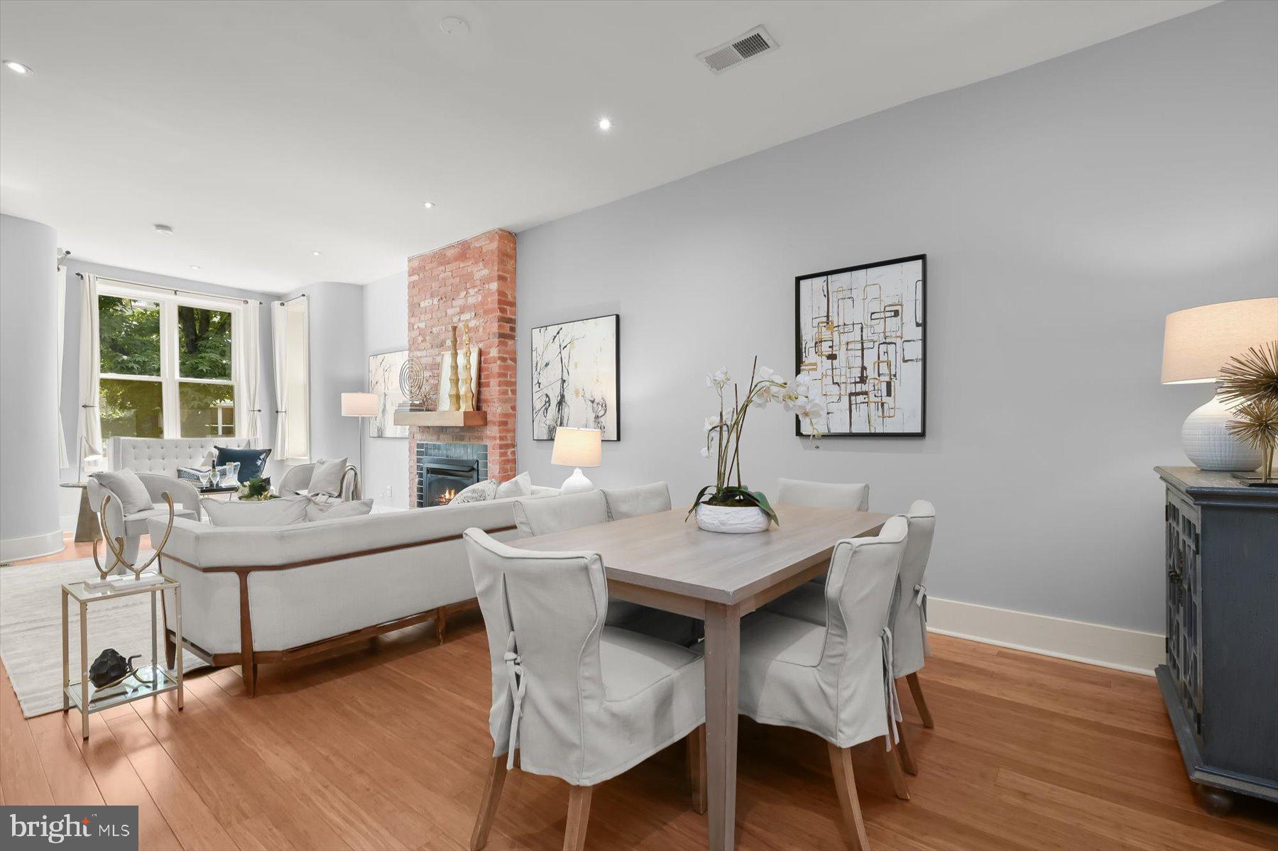2128 1st Street Northwest, Unit 1 Washington, DC 20001 - Photo 8 of 36 a view of a dining room with furniture window and wooden floor