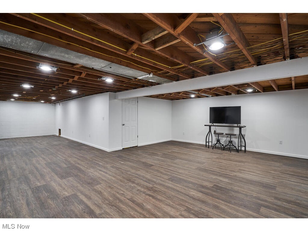 11530 Girdled Road Painesville, OH 44077 - Photo 12 of 32 Basement featuring dark hardwood / wood-style flooring