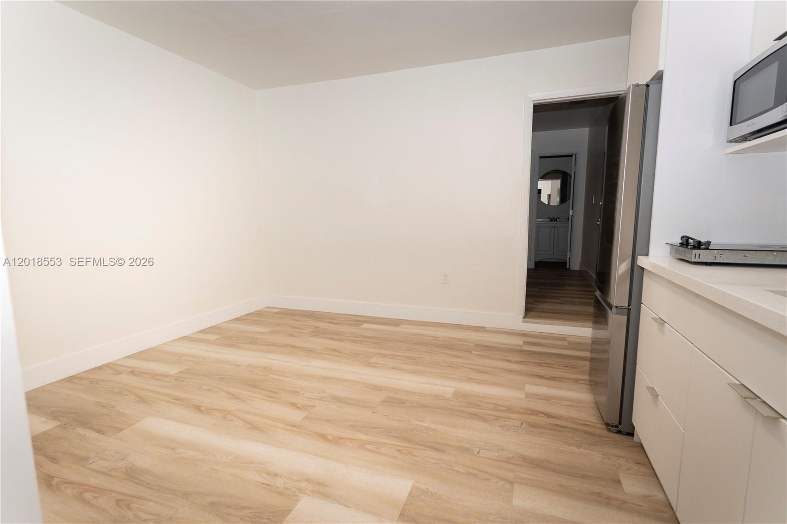 111 Southwest 31st Court Miami, FL 33135 - Photo 19 of 27 a view of a room with wooden floor