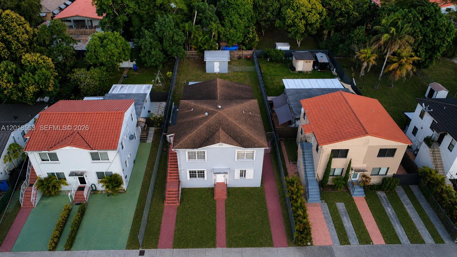 111 Southwest 31st Court Miami, FL 33135 - Photo 2 of 27 an aerial view of a house with a garden and trees
