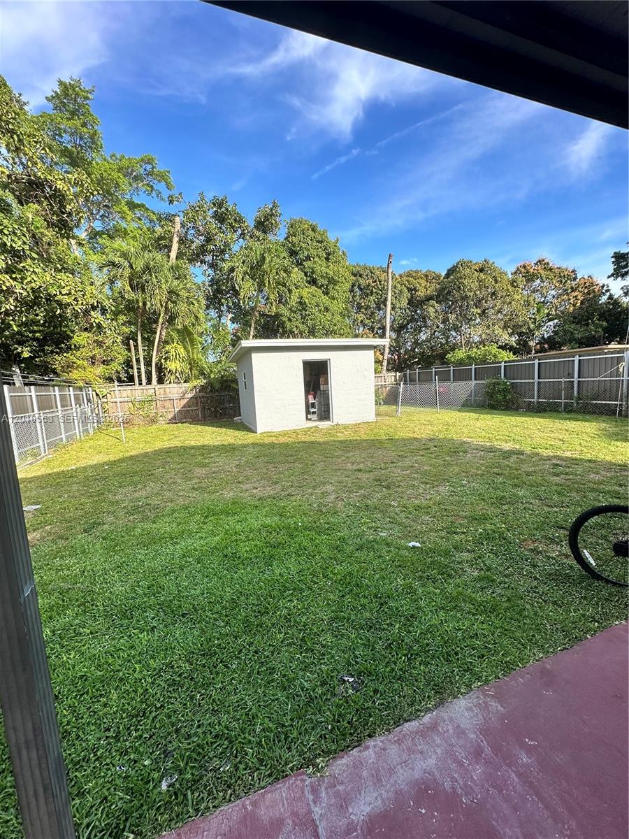 111 Southwest 31st Court Miami, FL 33135 - Photo 22 of 27 a view of a lake with a yard