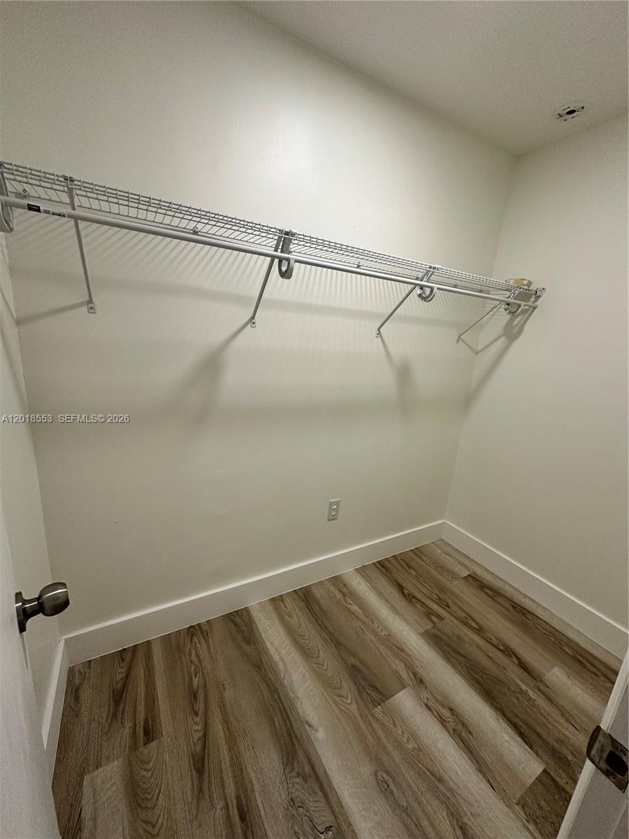 111 Southwest 31st Court Miami, FL 33135 - Photo 10 of 27 a view of a room with racks on the wall