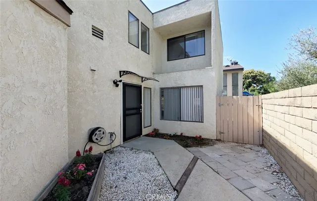 a balcony with table and chairs