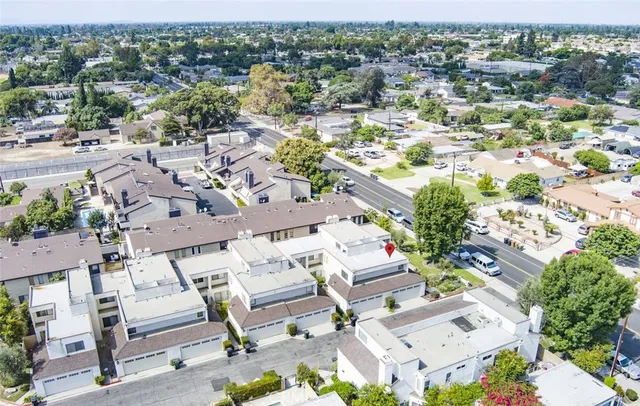 an aerial view of a house with a swimming pool and outdoor space