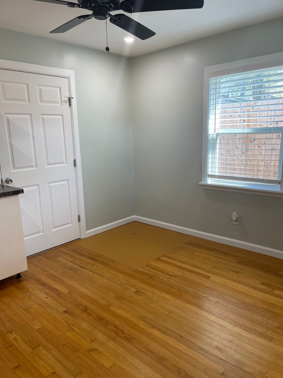 3102 Jarvis Street, Unit 2 Houston, TX 77063 - Photo 6 of 15 a view of an empty room with wooden floor and a window