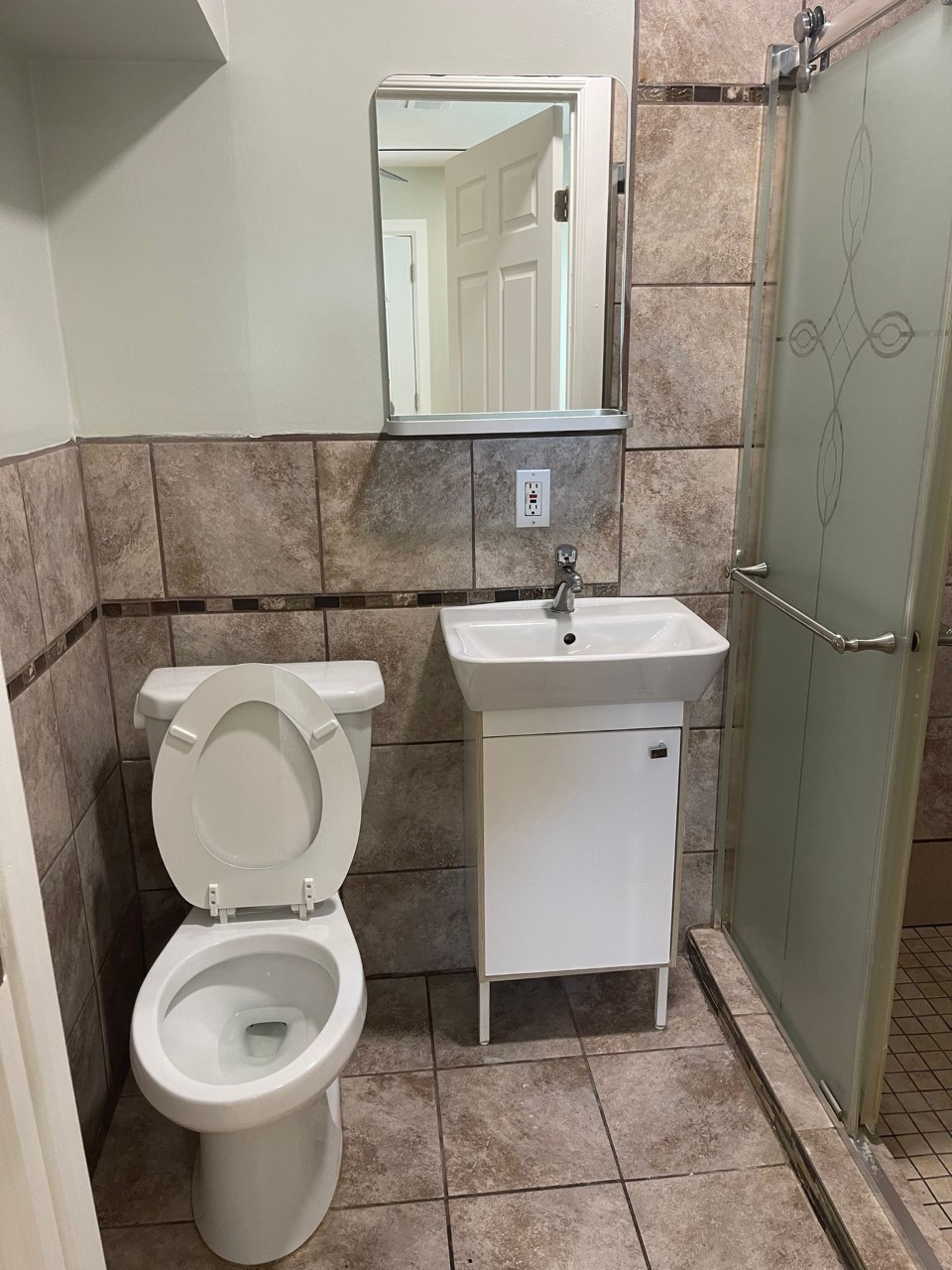 3102 Jarvis Street, Unit 2 Houston, TX 77063 - Photo 8 of 15 a bathroom with a toilet sink and mirror