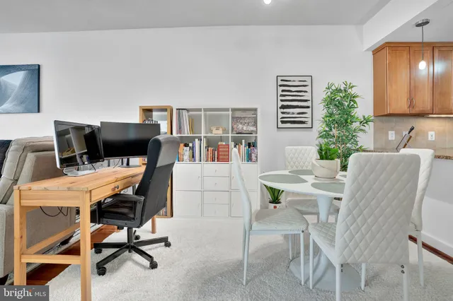 a view of a workspace with furniture