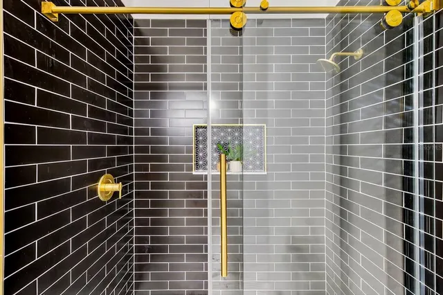 an aerial view of residential houses with outdoor space and swimming pool