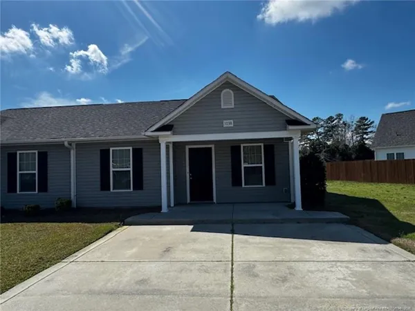 a front view of a house having yard