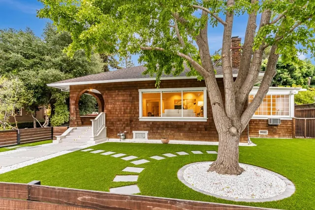 a front view of a house with a yard