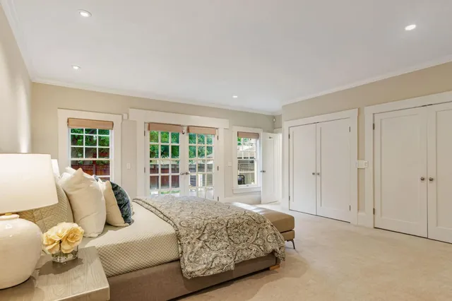 a bathroom with a double vanity sink a mirror and a bathtub