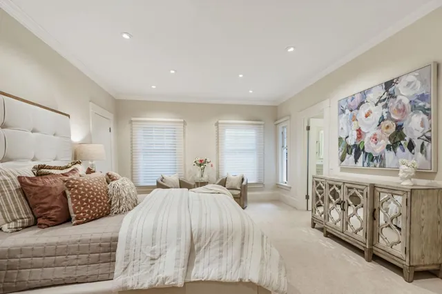 a bedroom with a bed and a couch