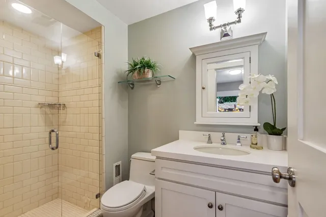 a bathroom with a sink double vanity and a mirror