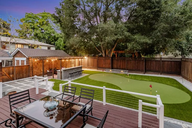 a view of a patio with a table and chairs
