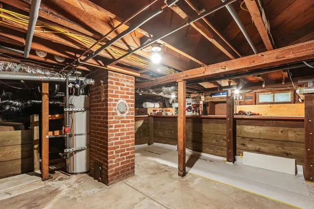a view of a house with wooden fence