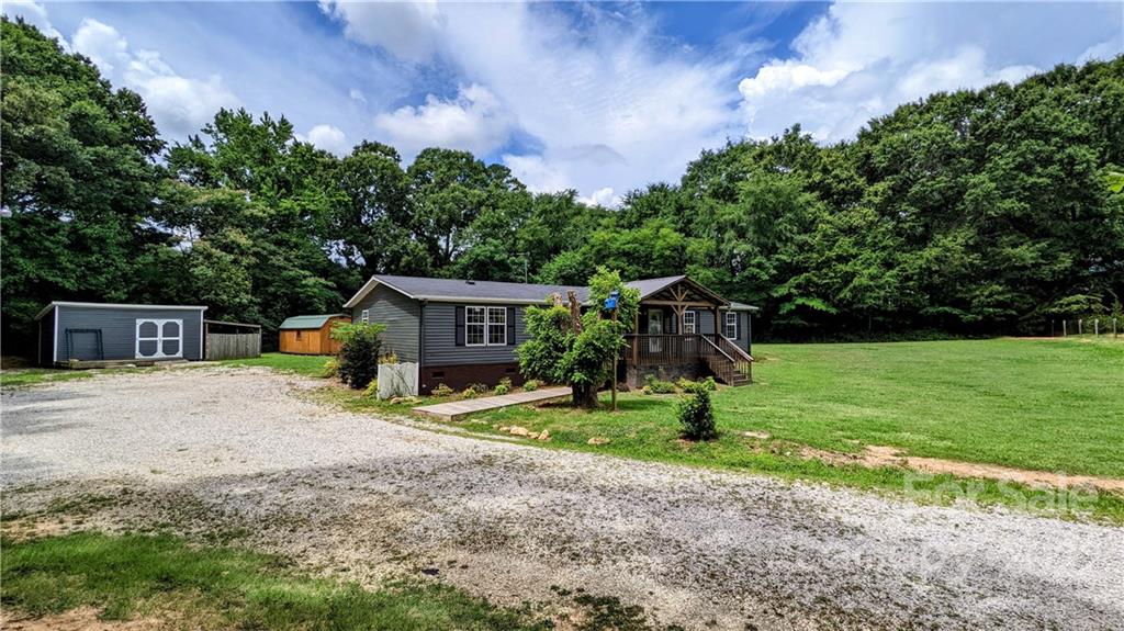 1715 Harris Road Fort Mill, SC 29708 - Photo 27 of 37 a front view of a house with garden
