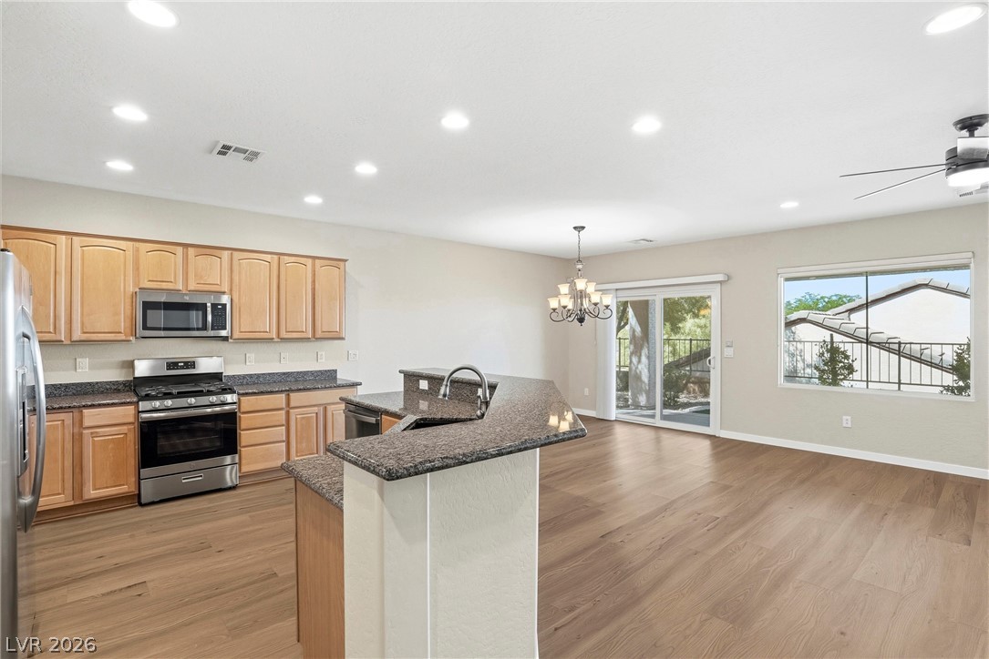 2541 Darda Street Henderson, NV 89044 - Photo 6 of 26 This open concept kitchen and living area features a bright and inviting atmosphere.