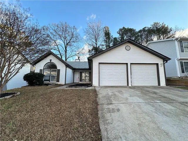 a house with trees in the background