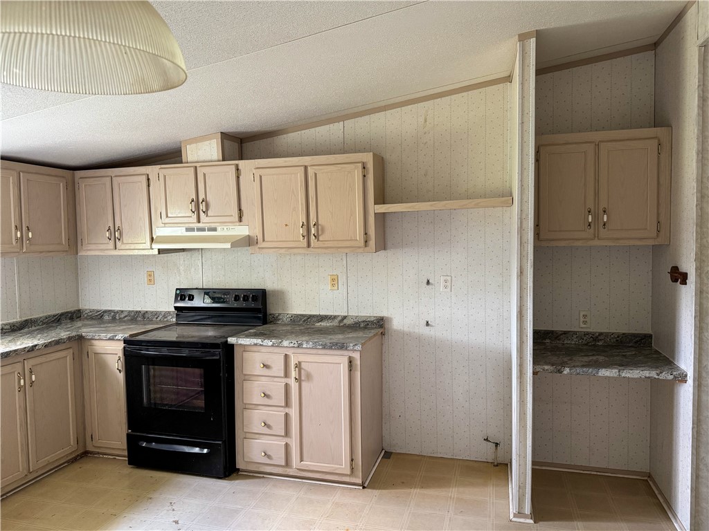24731 County Road 340 Mathis, TX 78368 - Photo 5 of 40 a kitchen with stainless steel appliances granite countertop a stove and a refrigerator