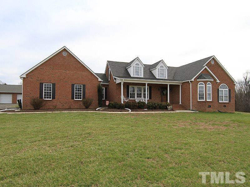 2200 Jim Latta Road Rougemont, NC 27572 - Photo 1 of 13 a front view of a house with a garden and yard
