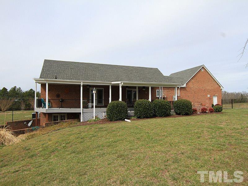 2200 Jim Latta Road Rougemont, NC 27572 - Photo 12 of 13 a front view of a house with a garden and porch
