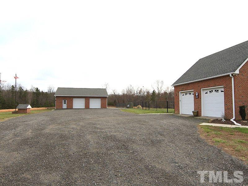 2200 Jim Latta Road Rougemont, NC 27572 - Photo 13 of 13 a view of a house with large windows and a yard