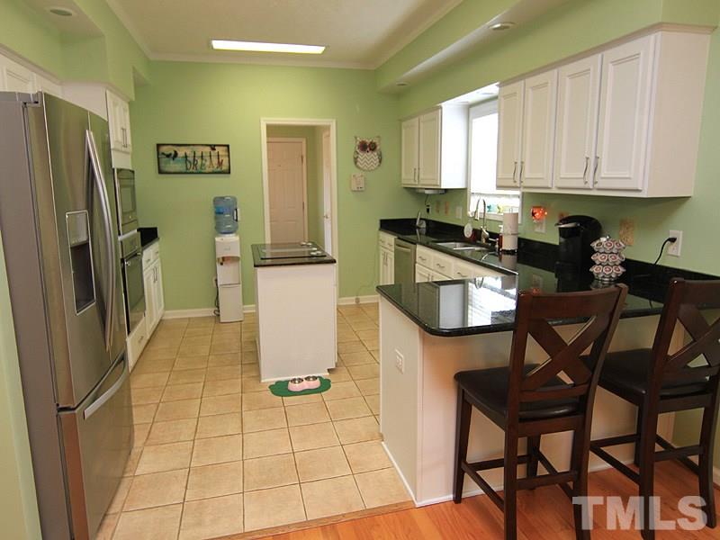 2200 Jim Latta Road Rougemont, NC 27572 - Photo 4 of 13 a kitchen with a refrigerator a stove a sink and cabinets