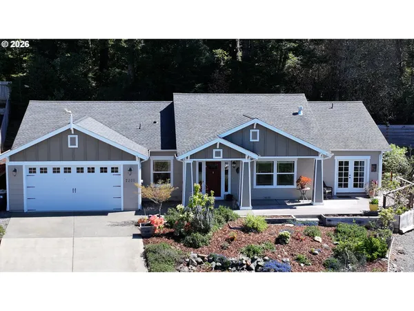 a aerial view of a house with a yard