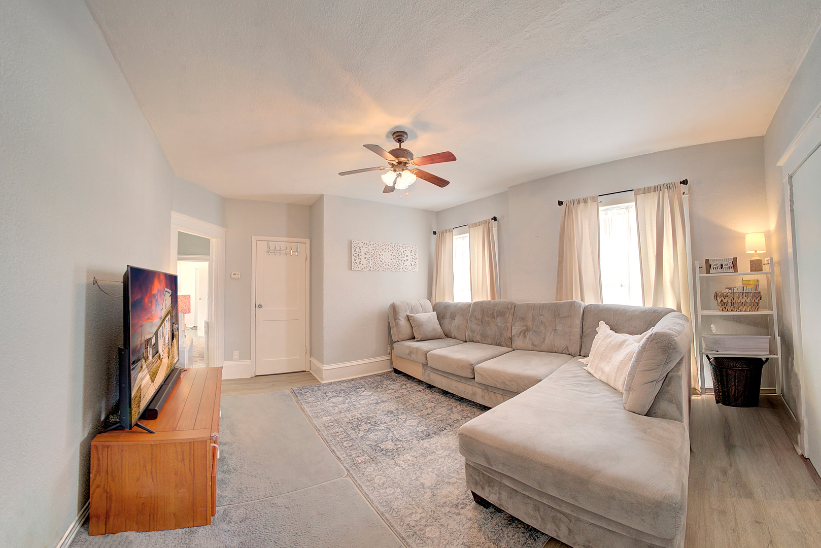 118 East 11th Street Lockport, IL 60441 - Photo 13 of 30 a living room with furniture a ceiling fan and a window
